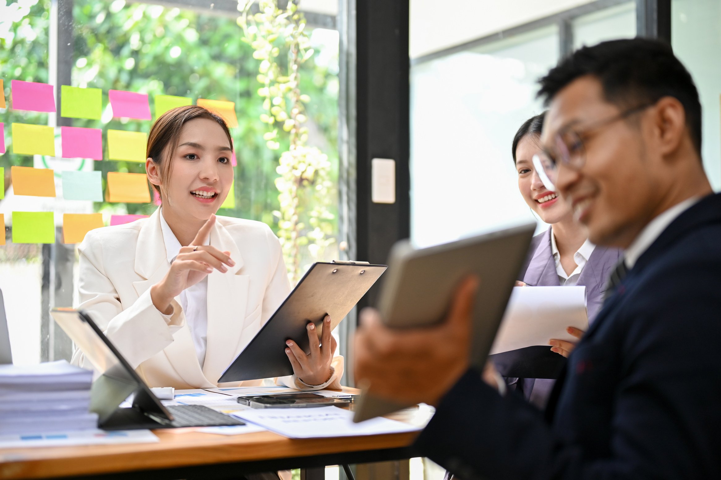 Professional millennial Asian board members having a formal meet